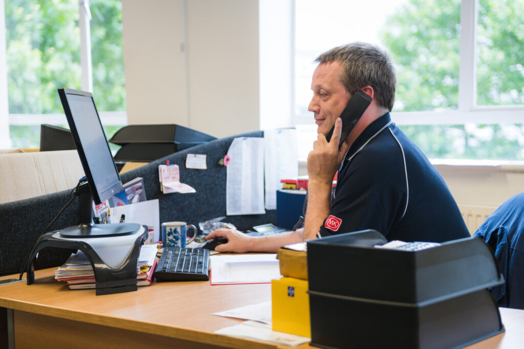 Bermondsey Sales Team member taking a call at his desk