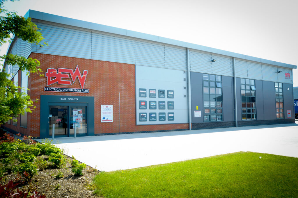 exterior of BEW Electrical Leicester showing BEW signage and car parking area