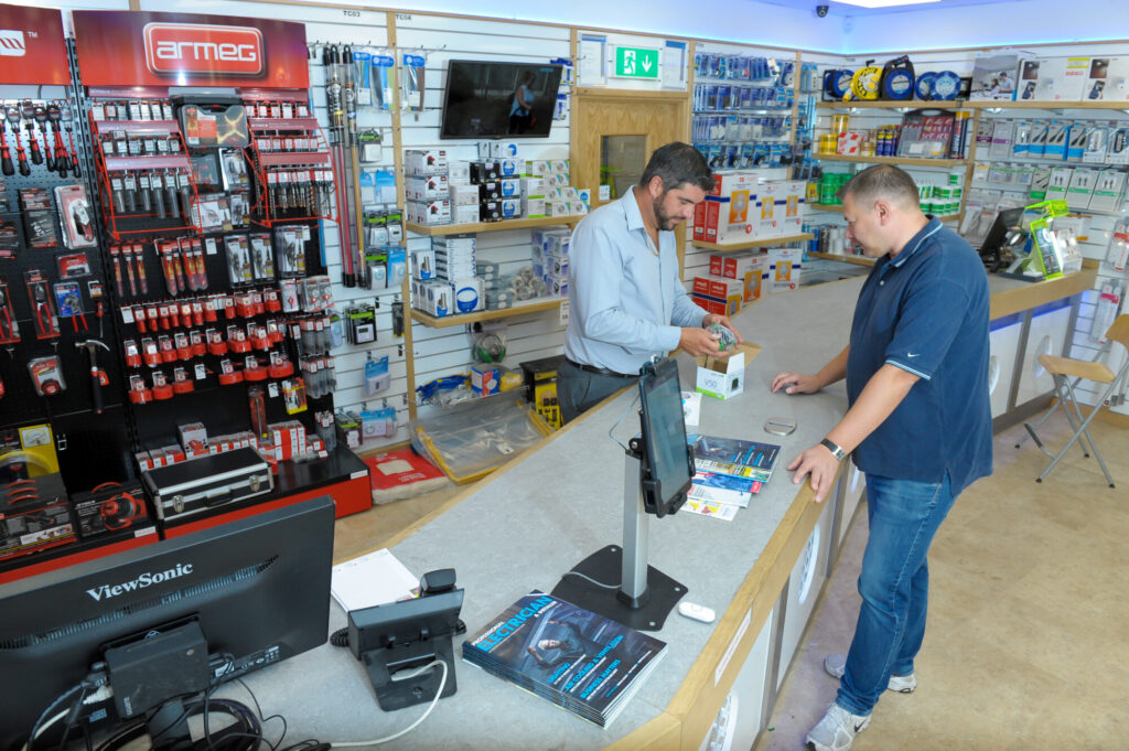 Customer being served and shown a product at BEW Telford