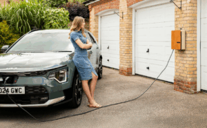 Women waiting for her EV to charge